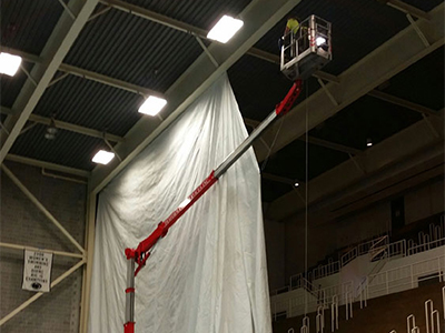 Using Teupen Lift to Hang Tarp at Penn State