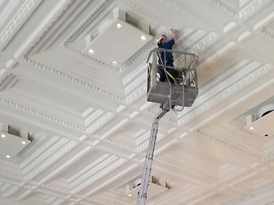 Using Specialty Lift to Clean Ceiling